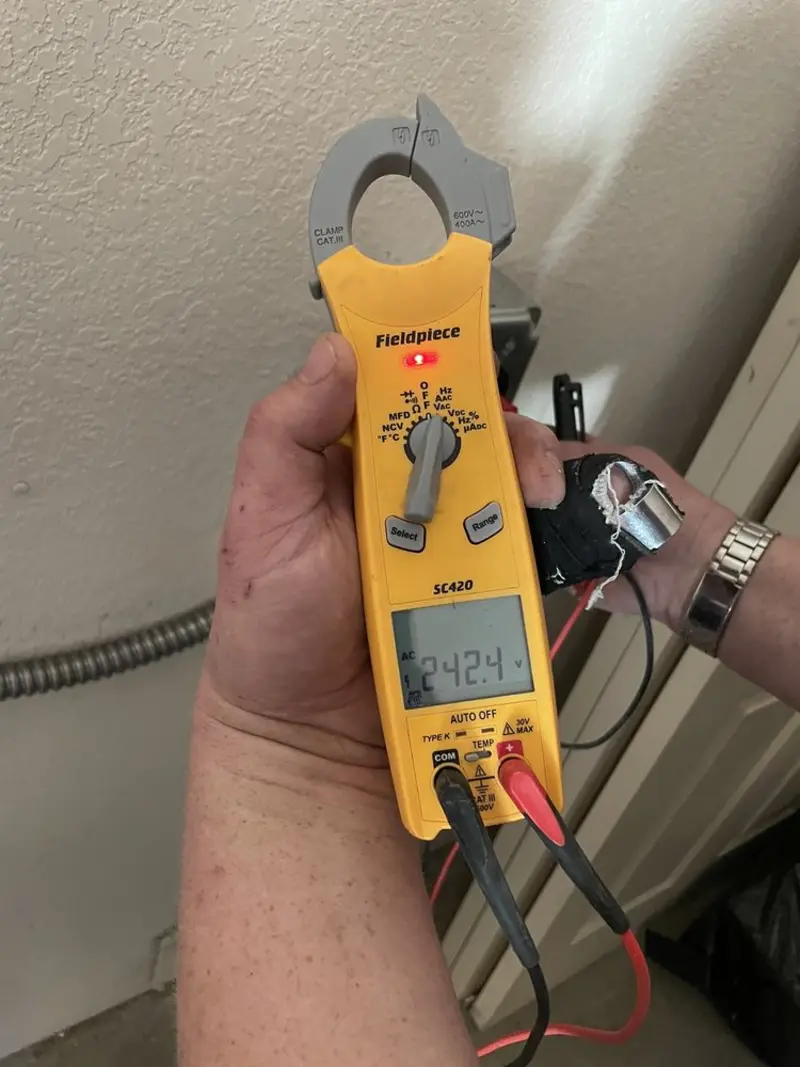 Voltage testing with clamp meter during Aluminum Wiring Replacement in Harrison